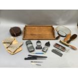 Spirit flasks, leather collar box, razor, cigarette holders, boot hook, hand mirrors, hat brush, oak