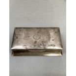 A silver cigarette box, rectangular with spreading base, the cover with central monogram FBG,