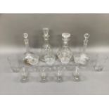 A pair of Edwardian star etched sherry decanters with facetted necks and stoppers, two further