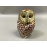 A Royal Crown Derby paperweight in the form of an owl, silver button to underside, 12cm high