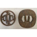 Two Japanese iron tsuba, one of rounded rectangular form pierced and cast with leaf fronds, 8.75cm x