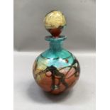 An Art Studio glass spherical bottle and stopper in coral, green, brown and gold leaf, swirls,