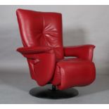 Himolla, Germany, c.2020, a deep red leather reclining armchair with leg rest, on a swivel base with