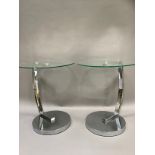 A pair of chrome and glass occasional tables, 45cm diameter x 55cm high