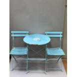 A blue enamelled circular folding patio table and a pair of slatted folding chairs