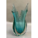 A studio glass vase c.1970s, blue cased in clear glass, of organic form, 39.5cm high