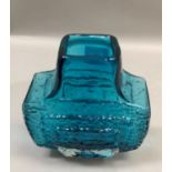 A Whitefriars textured glass TV vase, designed by Geoffrey Baxter, in kingfisher blue, 18cms high