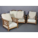 An oak framed suite c.1920s, the two seater sofa having a double arched and pierced back, the arm