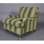 A Duresta armchair upholstered in green and gold striped velvet and flat weave fabric, on turned
