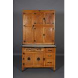 A Hygena oak and veneered kitchen cabinet , fitted with two double door cupboards flanked by a