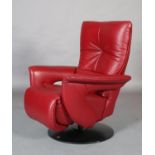 Himolla, Germany, c.2020, a mid red leather reclining armchair with leg rest, on a swivel base