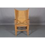 An Orkney winged chair, pale oak and skep work, woven cord seat, on square framing