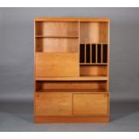 A Danish teak wall unit c.1970s having open compartments, record slots, drop front with shelved