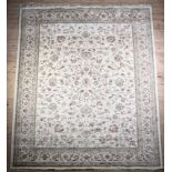 A Caucasian silk rug woven with all over plants form on a pale ivory ground within borders, 380cm