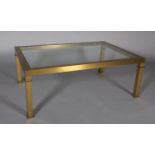 A brass and glass inset coffee table, rectangular, on square legs, 124cm wide x 84cm deep x 64cm