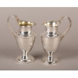 A MATCHED PAIR OF SMALL SILVER 'VICTORIA AND ALBERT' JUGS of tapered cylindrical form with beaded