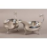 A PAIR OF MID 18TH CENTURY SILVER SAUCEBOATS, Robert Innes, London 1748, with bracketed rim, leaf