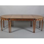 A HEPPLEWHITE REVIVAL MAHOGANY DINING TABLE c.1915, having two 'D' ends and centre rectangular