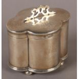 AN EDWARD VII SILVER QUATREFOIL TRINKET BOX on bun feet with pierced finial, London 1906