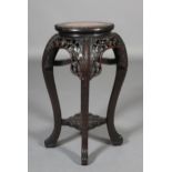 A LATE 19TH CENTURY CHINESE HARDWOOD AND INSET MARBLE URN STAND, circular with fluted rim, above a