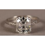 A SINGLE STONE DIAMOND RING IN PLATINUM BY BOODLE AND DUNTHORNE, the emerald cut stone Anchor Cert