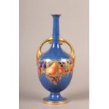 A ROYAL WORCESTER TWO HANDLED VASE painted with a band of pears, peaches, plums, gooseberries and