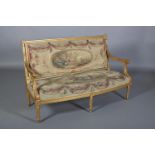 AN 18TH CENTURY REVIVAL GILTWOOD SOFA having an encircling frame carved with bead, riband and