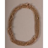 A VICTORIAN MUFF CHAIN IN 9CT ROSE GOLD faceted belcher links with swivel fastener, approximate