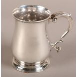 A MID 18TH CENTURY SILVER BALUSTER MUG, Fuller White, London 1757, leaf capped scroll handle, on
