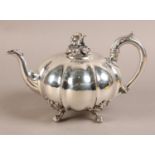 A 19TH CENTURY SILVER TEAPOT BY PAUL STORR, London 1837, of compressed and lobed form, the low domed