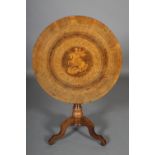 A VICTORIAN WALNUT TILT TOP TABLE, circular, inlaid in fruitwood with George and the Dragon within