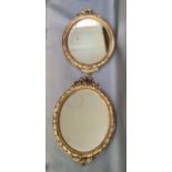 A PAIR OF 19TH CENTURY GILT GESSO LAUREL LEAF AND STRAPWORK MOULDED PICTURE FRAMES oval, with ribbon