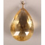 A CITRINE PENDANT c.1950, the pear shaped brillotte facetted stone hung from a single pendant loop
