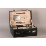 A WALKER AND HALL BLACK MOROCCO LEATHER TRAVEL CASE c.1939, lined in moire silk and fitted with a