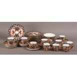 A ROYAL CROWN DERBY CHINA TEA SERVICE, pattern 2451, comprising ten cups and twelve saucers,