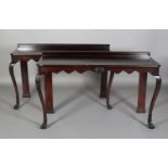 A PAIR OF IRISH MAHOGANY HALL TABLES, 18th century and later, having short raised back and a