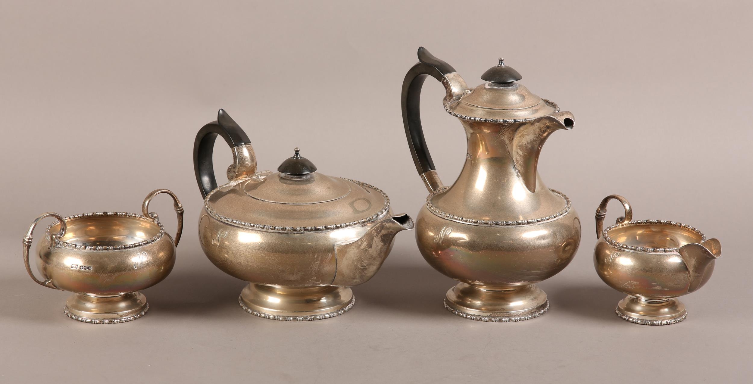 A GEORGE V FOUR PIECE SILVER TEA SERVICE, Walker & Hall, Sheffield 1934, comprising teapot, hot