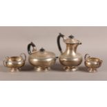 A GEORGE V FOUR PIECE SILVER TEA SERVICE, Walker & Hall, Sheffield 1934, comprising teapot, hot