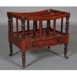 AN EARLY 19TH CENTURY MAHOGANY CANTERBURY of three railed divisions above a cockbeaded drawer with