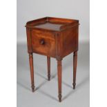 A GEORGE IV MAHOGANY POT CUPBOARD having a three-quarter gallery above a single door cupboard on