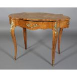 A FRENCH WALNUT AND GILT MOUNTED TABLE of serpentine quatrefoil outline, inlaid with leafage to