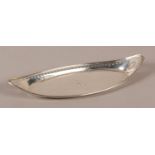 A GEORGE III SILVER SNUFFER TRAY of oval boat shaped form with a pierced reeded rim and engraved