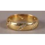 A DIAMOND SET BAND RING IN 18CT GOLD BY CHARLES GREEN & SON, the eight cut stones grain set in