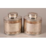A PAIR OF EARLY 19TH CENTURY PLATED ON COPPER OVAL TEA CADDIES brightcut with bands of flower