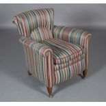 AN EDWARD VII MAHOGANY ARMCHAIR, upholstered in striped fabric on square tapered legs on brass