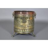 A VICTORIAN BRASS AND COPPER LOG BIN embossed with a continuous band of blossom and fruit centred