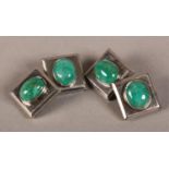 A PAIR OF EMERALD CUFFLINKS, each face collet set to the centre with an oval cabochon stone raised