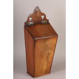 A GEORGE III MAHOGANY CANDLE BOX, the raised back with hanging loop and pierced with trefoils,