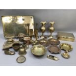 A collection of brassware including two pairs of Benares brass vases, pair of candlesticks,