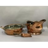 A copper two handled stock pan, 52cm over the handles, together with a copper coal scuttle and